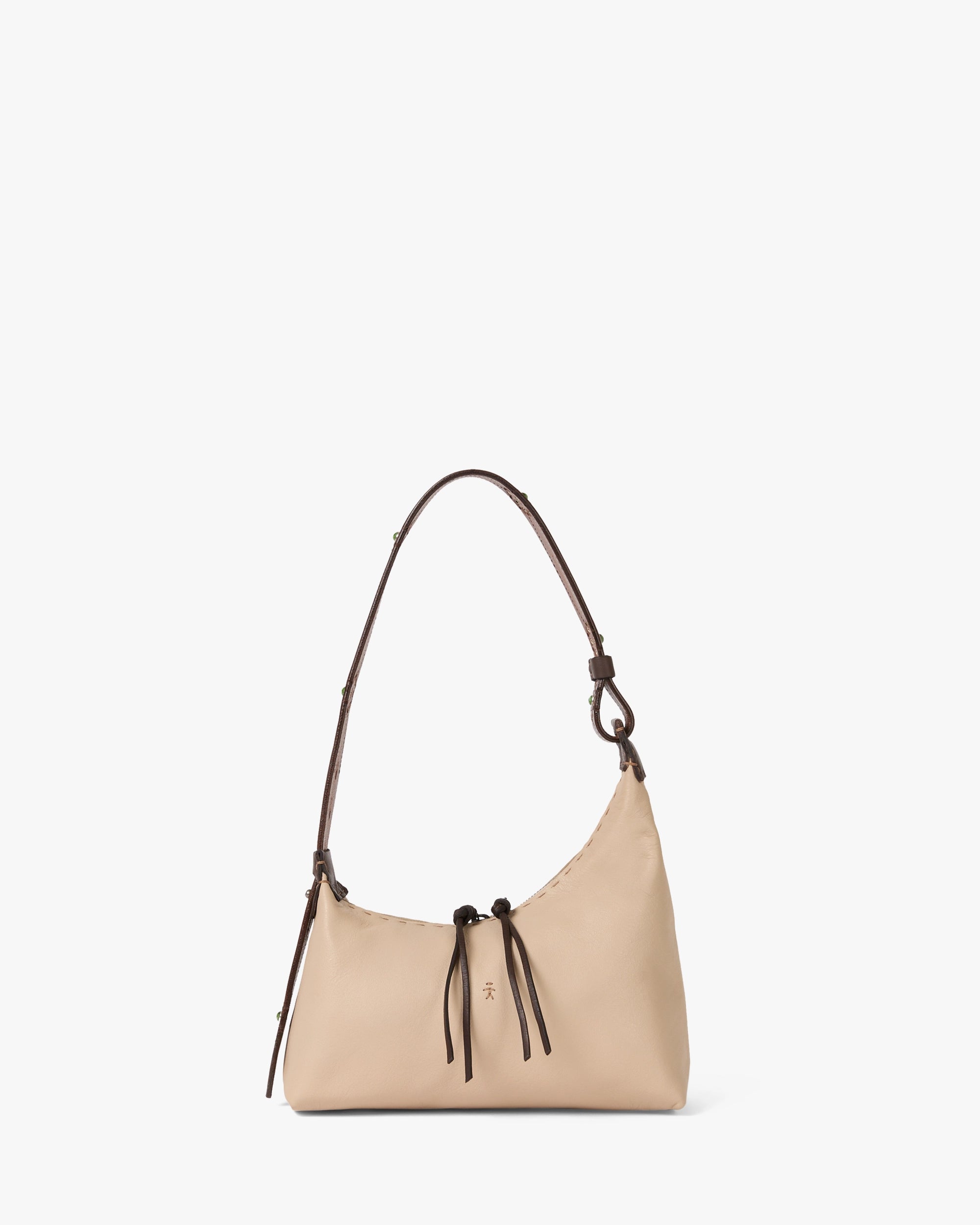 Beige handbag with brown leather strap